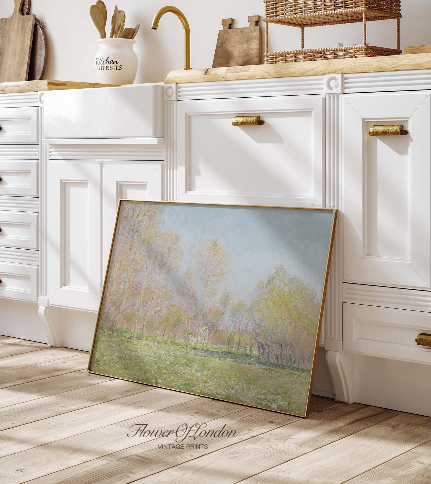 a picture frame sitting on the floor in a kitchen