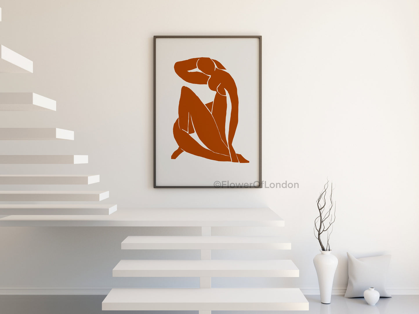 Framed Matisse exhibition poster in burnt orange on a gallery wall with natural light