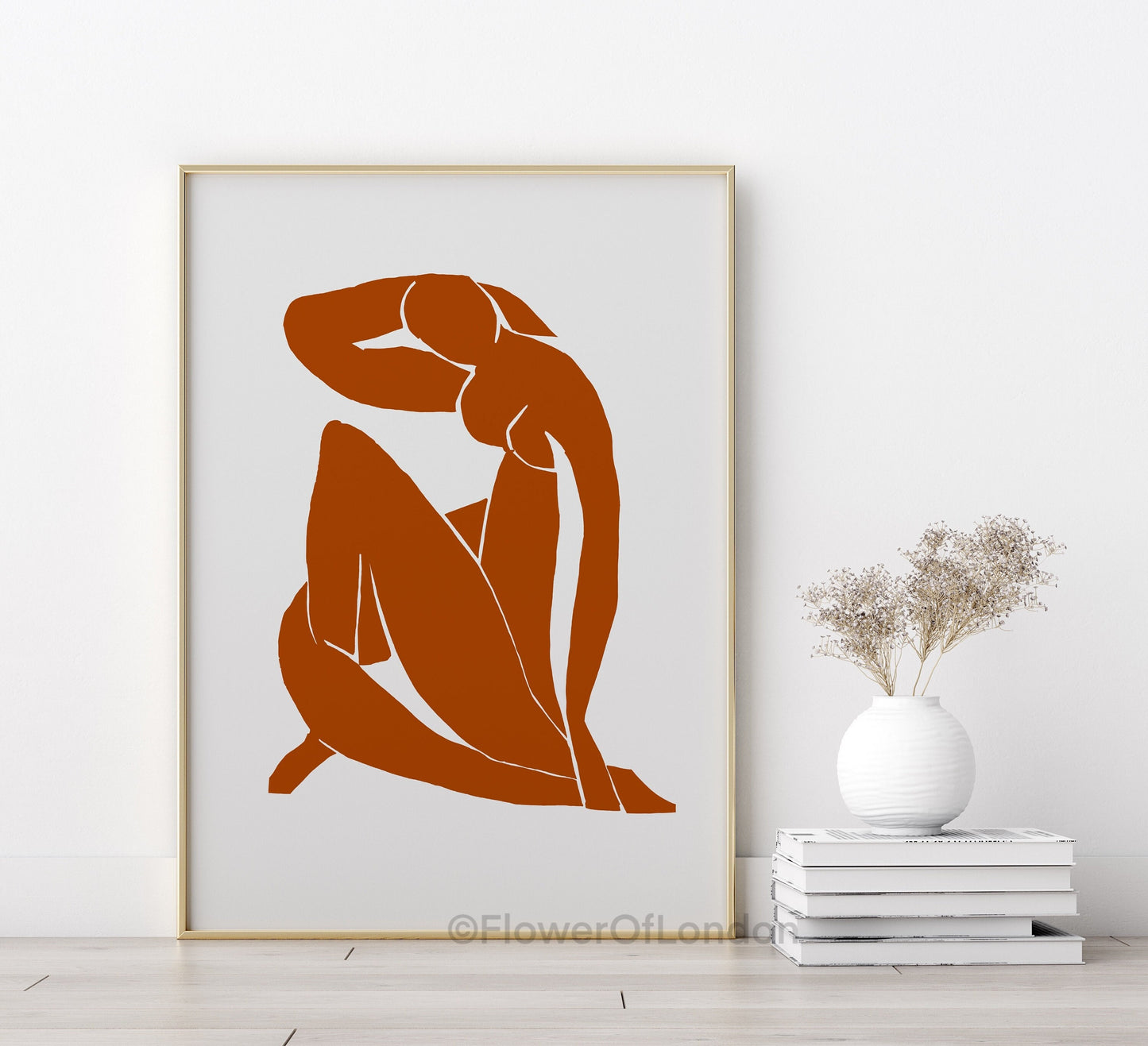 Blue Nude II Matisse abstract print in terracotta displayed in a modern living room
