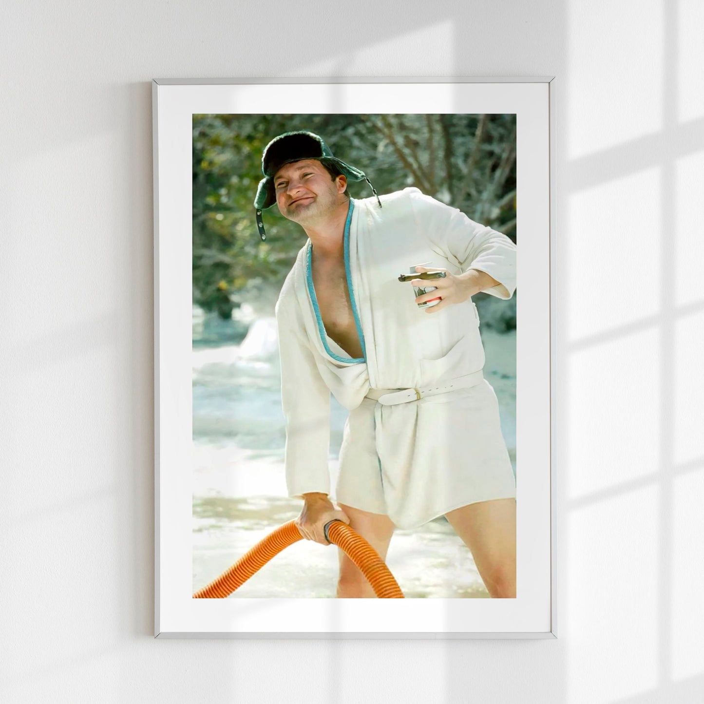Cousin Eddie Christmas Vacation movie bathroom print on a sun lit wall in a room