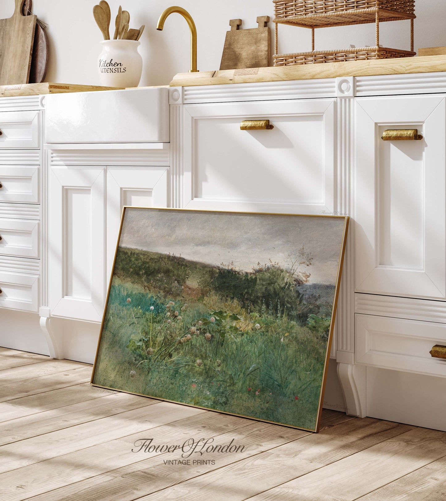 a picture frame sitting on the floor in a kitchen