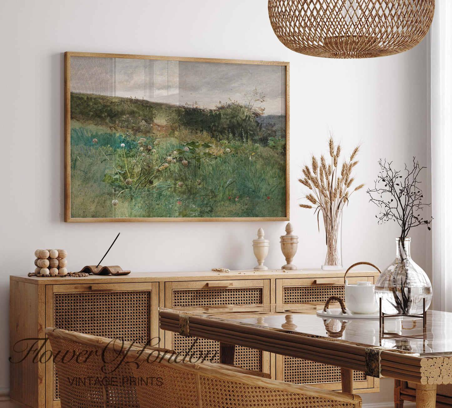 a painting hanging on a wall above a dining room table