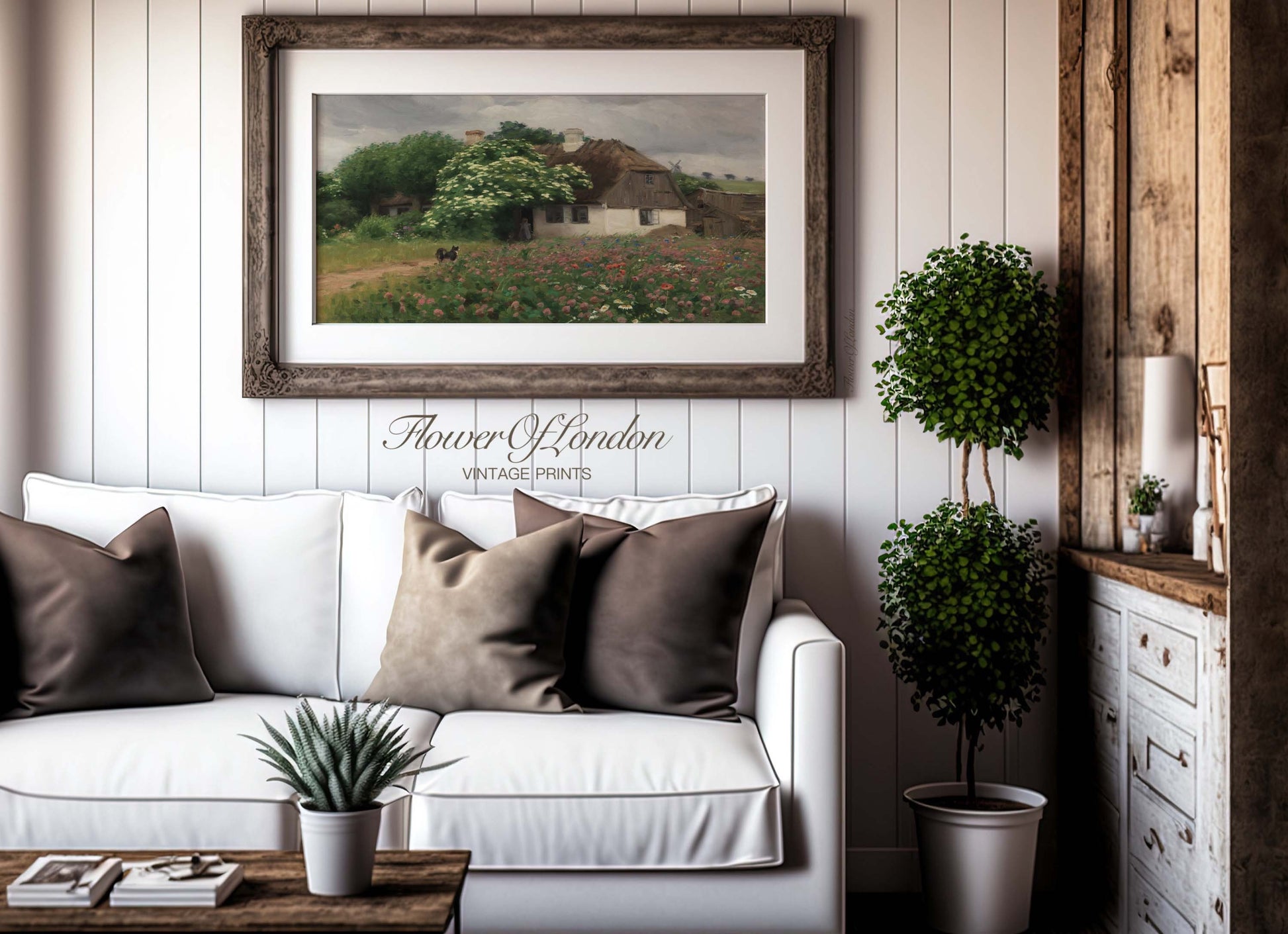 a living room filled with furniture and a painting on the wall