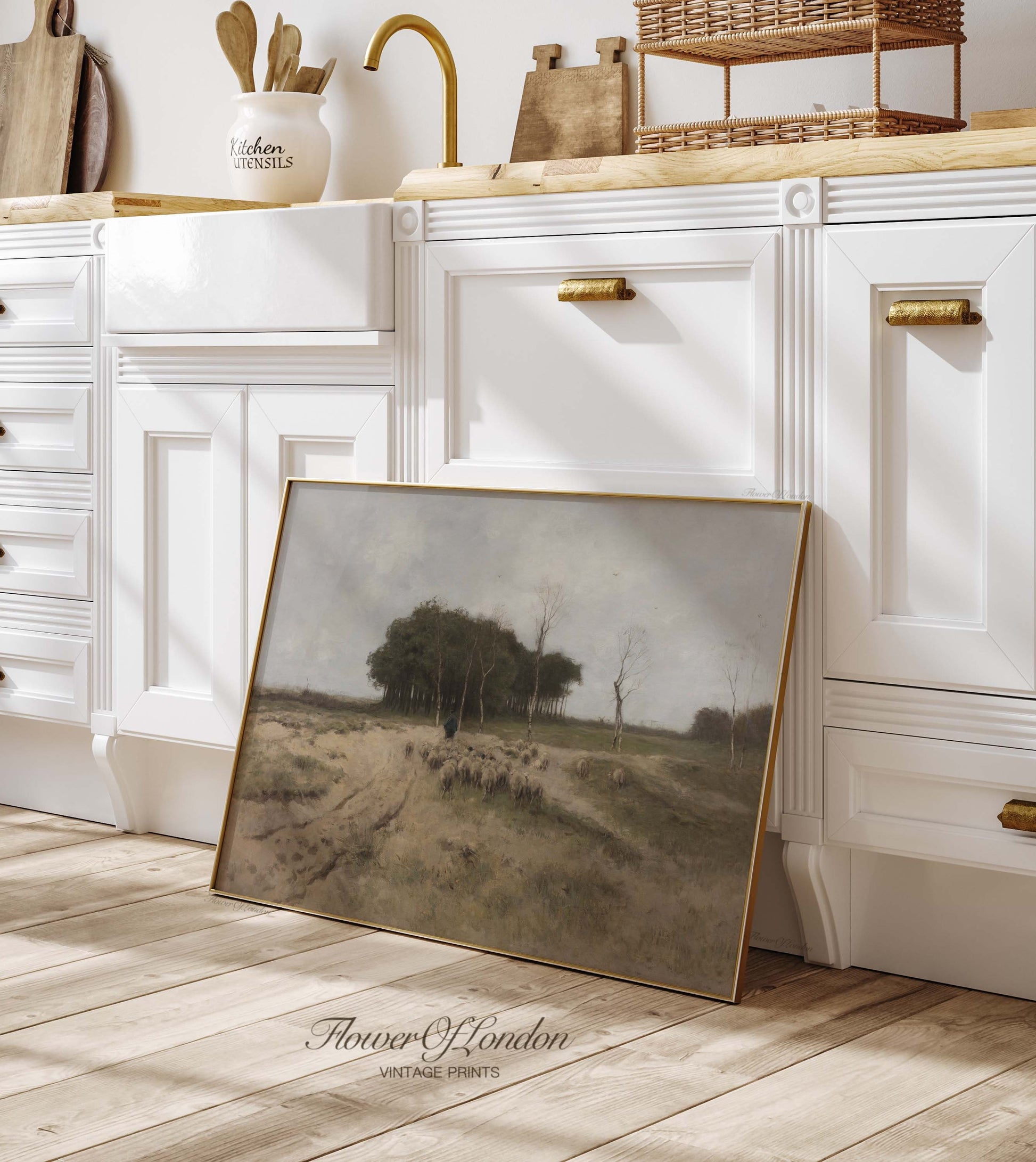 a picture frame sitting on the floor in a kitchen