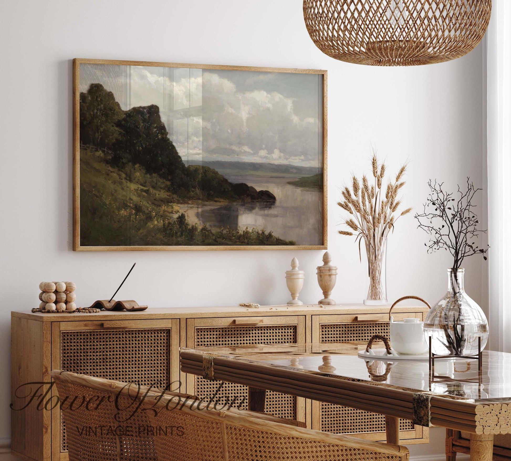 a painting hanging on a wall above a dining room table