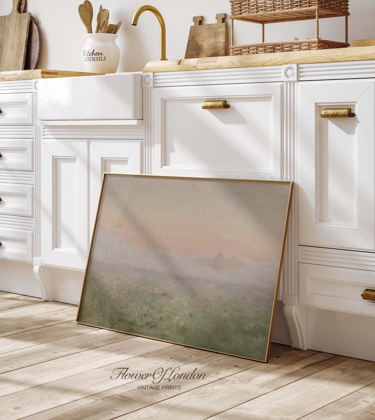 a picture frame sitting on the floor in a kitchen