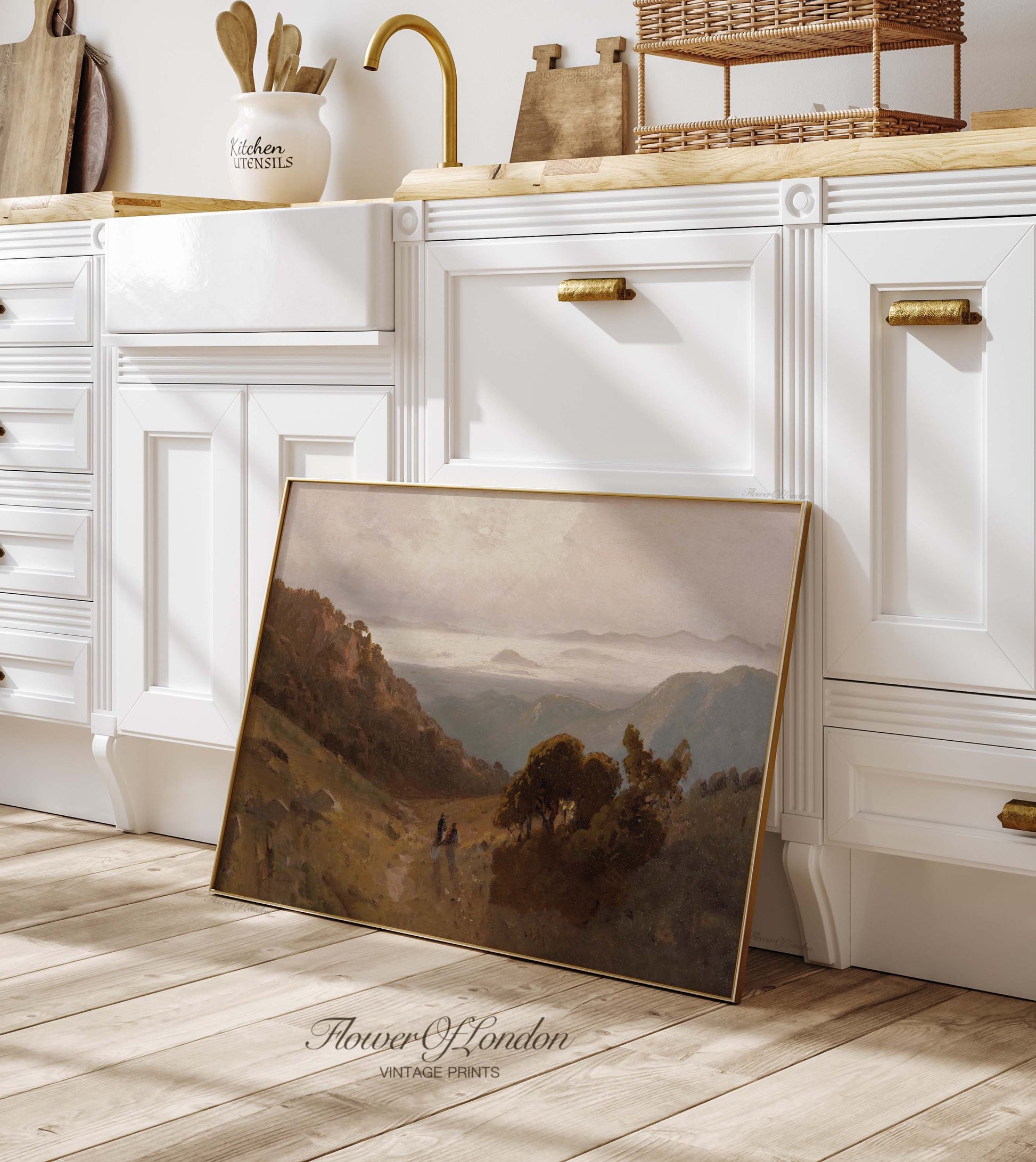 a picture frame sitting on the floor in a kitchen