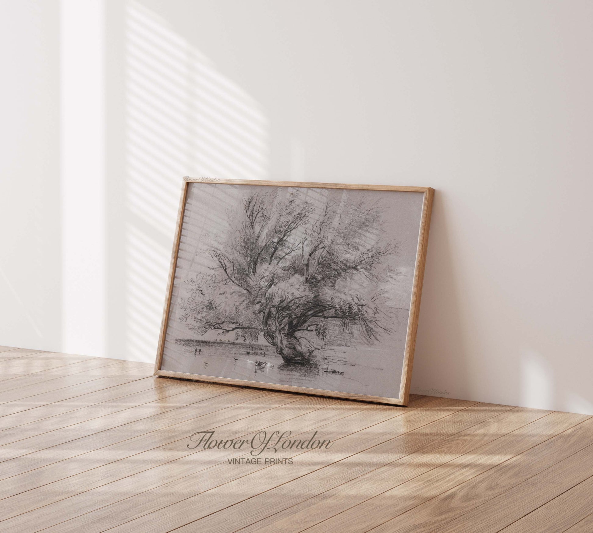 a black and white photo of a tree in a room