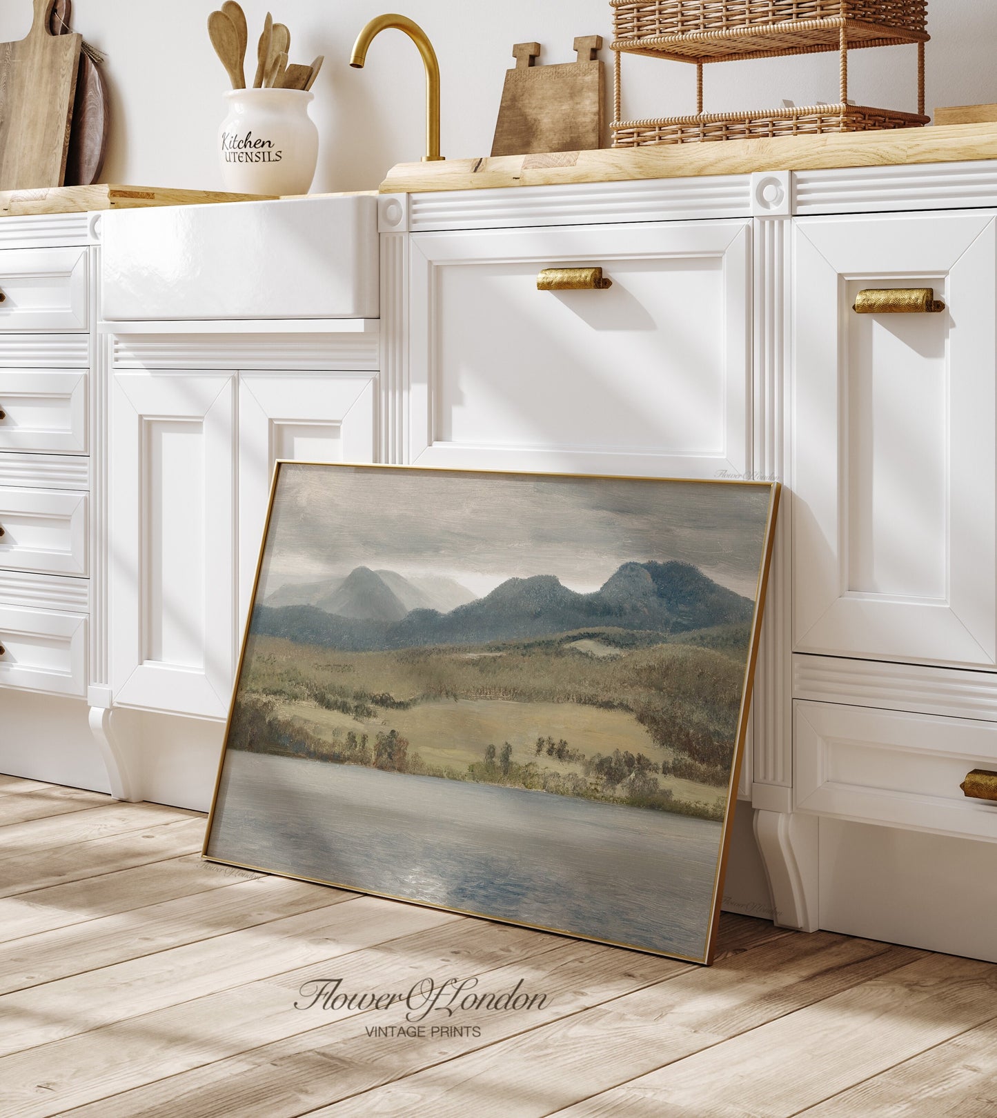 a picture frame sitting on the floor in a kitchen