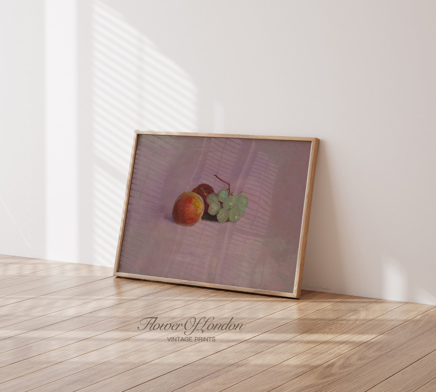 a picture frame with a picture of two apples