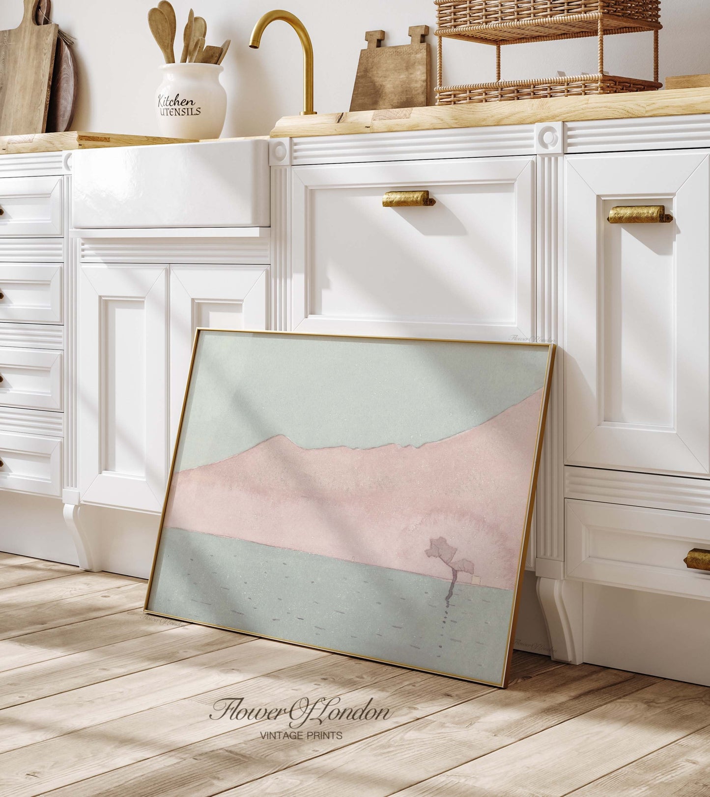 a picture frame sitting on the floor in a kitchen