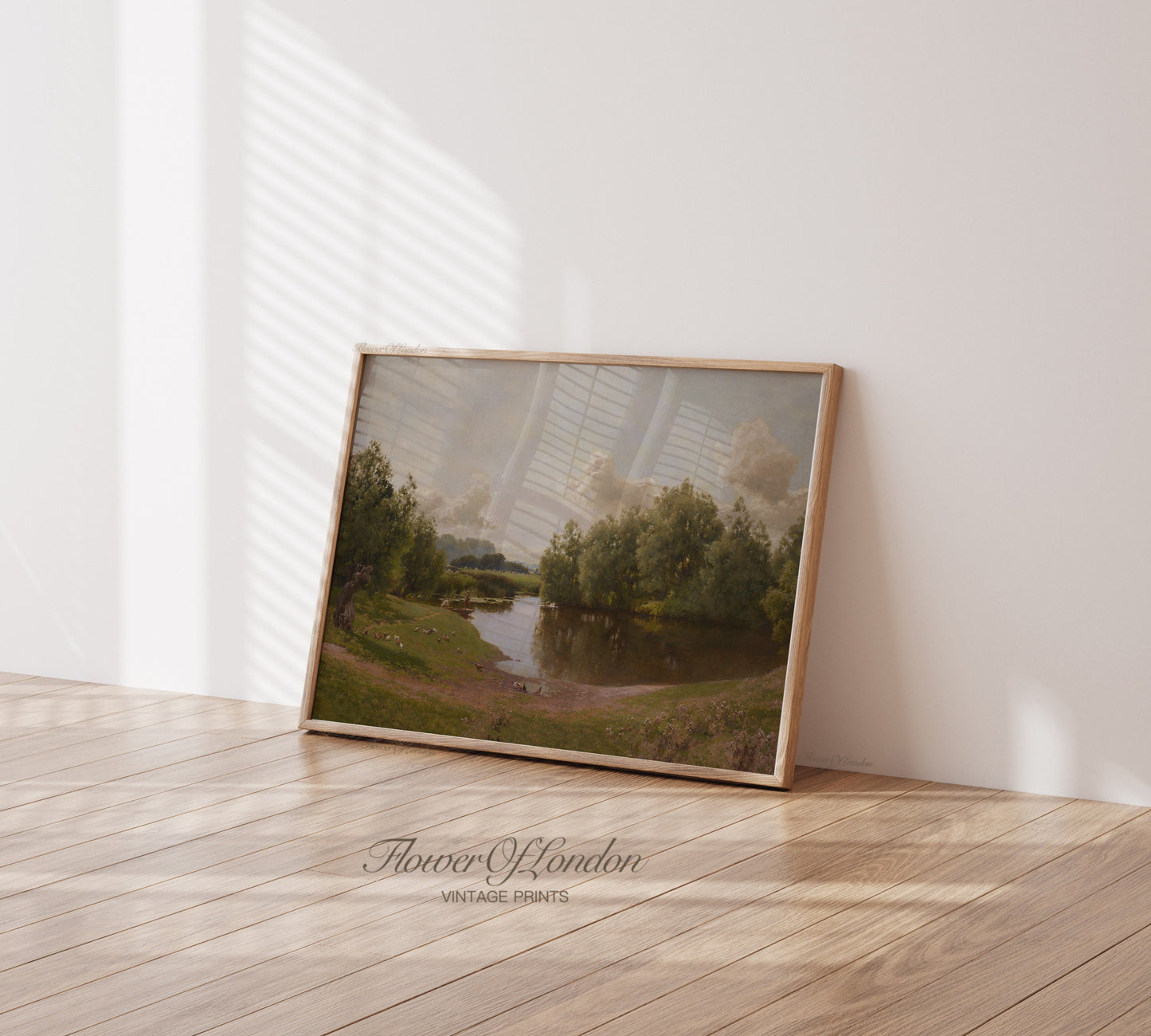 a picture frame sitting on the floor in front of a wall