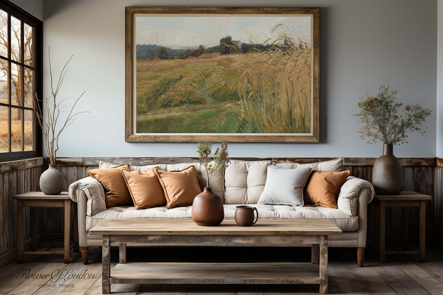 a living room filled with furniture and a painting on the wall