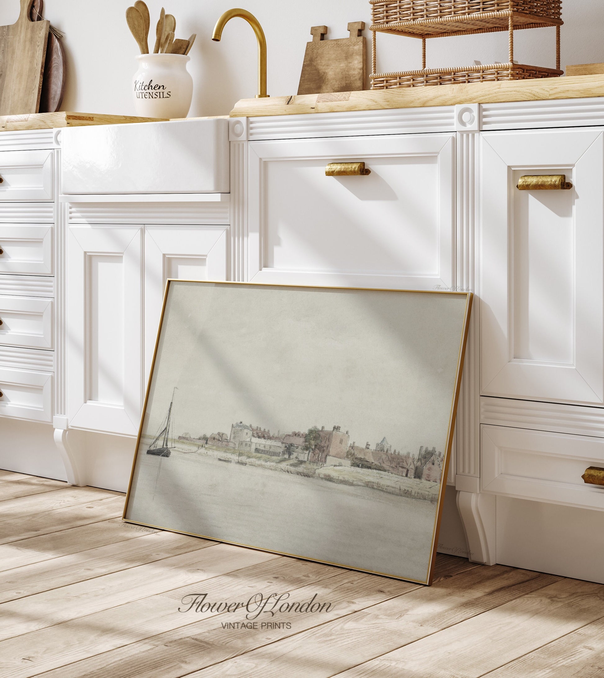 a picture frame sitting on the floor in a kitchen