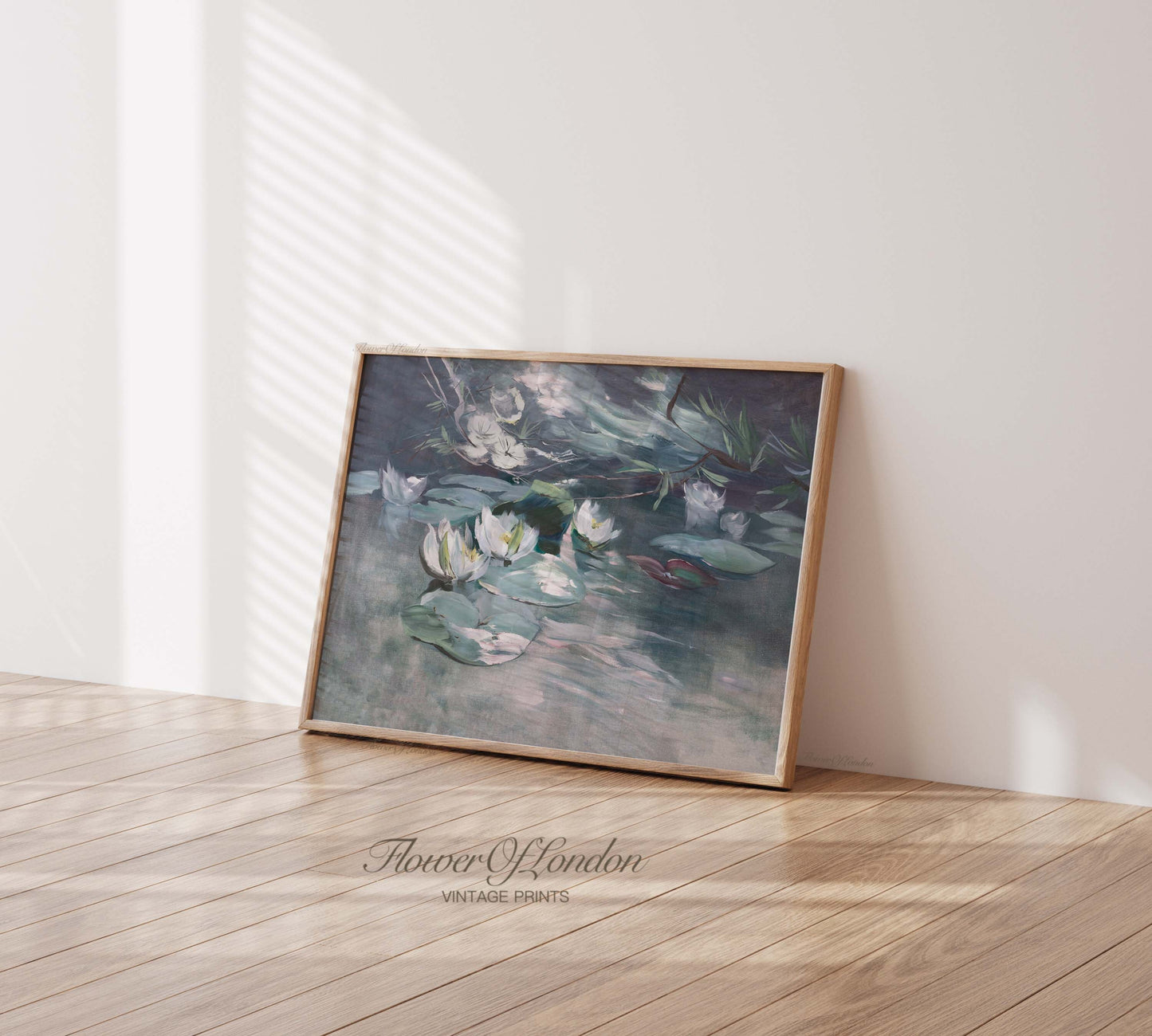 a picture of water lilies in a frame on the floor