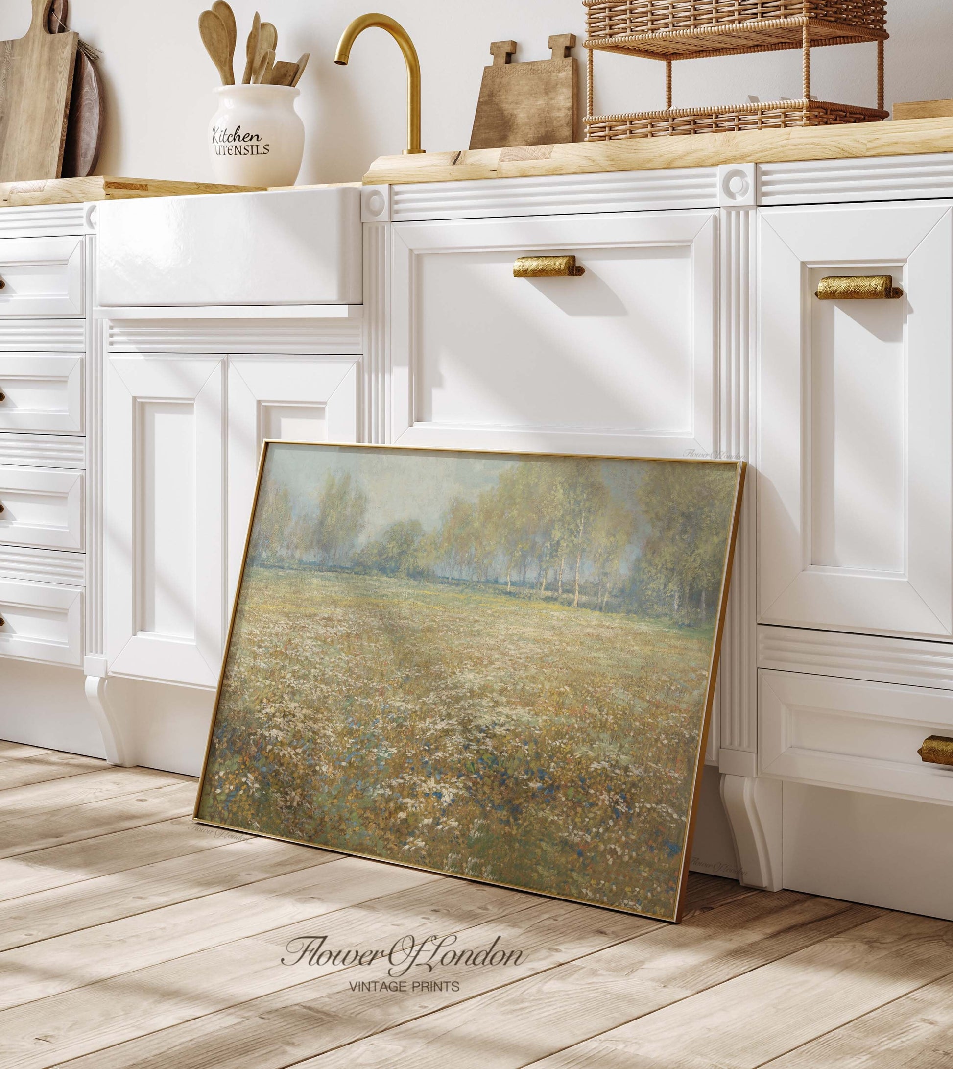 a picture frame sitting on the floor in a kitchen