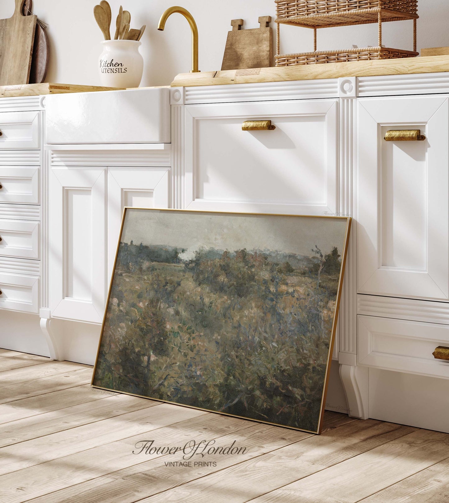 a picture frame sitting on the floor in a kitchen