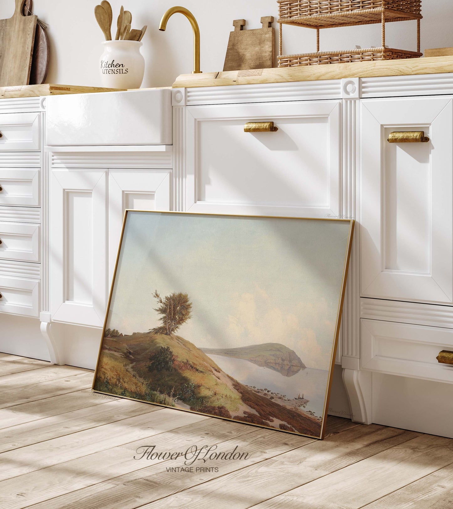 a picture frame sitting on the floor in a kitchen